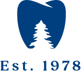 tooth icon with tree cutout stating established in 1978